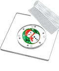 Slick Square Acrylic Cookie Decorating Turntable With Anti Slip Silicone Mat, featuring festive snowman design on clear platter.