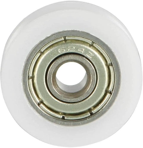Four Pack V Groove Bearing Pulleys Featuring Rock Hard Metal Rollers Wrapped In Beefy Nylon Wheels For A Slick Glide On Linear Rail Tracks Measuring Four Millimeter Bore By Eighteen Outer Diameter By Six Thick To Lock In Your Build, showing a close-up of a nylon wheel with a metal bearing.