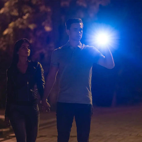 Couple walking at night with Tactical LED Flashlight With Aluminum Alloy Body, Zoomable Beam, Up To 1,000 Feet Reach