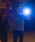 Couple walking at night with Beast Mode Bright Tactical LED Flashlight With Aluminum Alloy Body Zoomable Strike Bezel Adjustable Beam Focus Long Lasting Power For 1000 Foot Reach 1700 Lumen Output Ideal For Outdoor Camping Security And Home Use