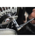 Using Workhorse 84 Piece Mechanics Tool Set With 72 Tooth Ratchet to tighten a bolt on an engine.