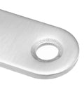 Close-up of a pre-drilled hole in Stainless Steel Corner Brackets Set 10 Pcs Flat Mending Plates For Wood Furniture Stability Heavy Duty Beefy Brackets With Pre Drilled Holes Easy Install No Wobble Anti Rust 37mm 47mm 56mm Sizes.