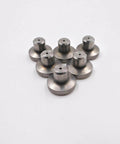 Waterjet outlet seat parts for a waterjet cutting machine; small metal discs with central cylindrical posts