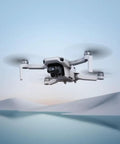 Ultra Lightweight Mini 4K Foldable Drone Fly More Bundle With 64GB Pro Card flying in scenic snowy landscape