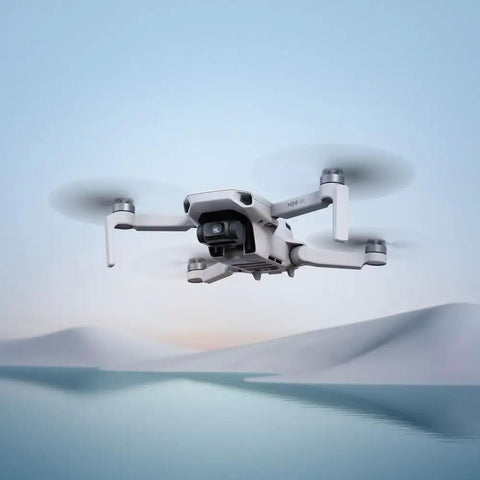 Ultra Lightweight Mini 4K Foldable Drone Fly More Bundle With 64GB Pro Card flying in scenic snowy landscape