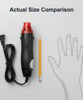Mini Heat Gun 300W Portable Hot Air Tool for Crafts and DIY Projects next to pencil and hand outline for size comparison.