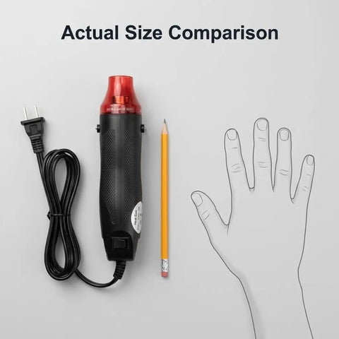 Mini Heat Gun 300W Portable Hot Air Tool for Crafts and DIY Projects next to pencil and hand outline for size comparison.