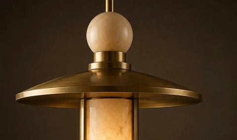 Close-up of Modern Brass Pendant Chandelier Light Fixture with Alabaster Cylinder Shade Luxury Natural Stone Hanging Ceiling Light with Spherical Marble Accent for Kitchen Dining Room, Bar & Living Room Set of 3.