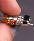 Badass Compact Linear Actuator Packing Smooth Planetary Gearbox And Solid Metal Mini Stepper Motor 2 Phase 4 Wire Dead Silent Performance Slick 10 Mm Throw For Garage Projects And Mods close-up of stepper motor with metal casing and wiring.