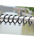 24 Pack Curtain Rings Clips Black Drapery Holders For Easy Hanging And Smooth Glide On Compatible Curtain Rods displayed outdoors