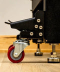 Side view of Heavy Duty Steel Caster Set For Router Tables, Workbenches, Cabinets And Tool Stands With 800 LB Capacity, installed.