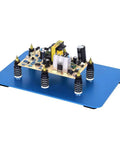 Six Piece Soldering Helping Hands Set for PCB Boards ESD Safe Metal Magnetic Fixture Tower with Blue Steel Base shown in use