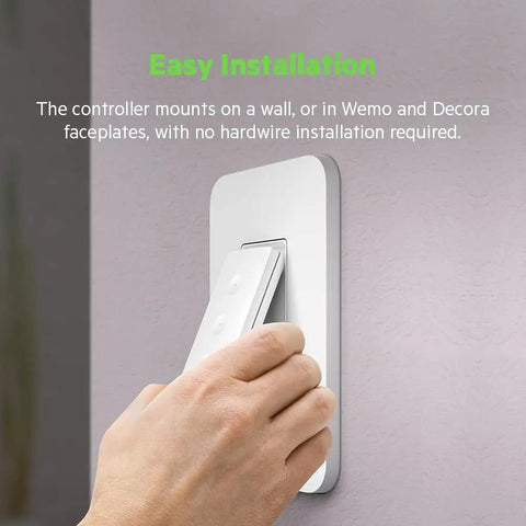 Hand installing Stage Scene Smart Remote For Apple HomeKit With Thread on wall for easy control of lights and switches.