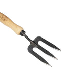 Compact Garden Fork For Tight Spaces, hand-forged boron steel tines, ergonomic ash handle, ideal for women gardeners and beginners.