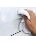 Virgin Terry Cotton Towels Pack Of 60, 14 By 17 Inches, White, used for cleaning, showing hand wiping surface with white towel