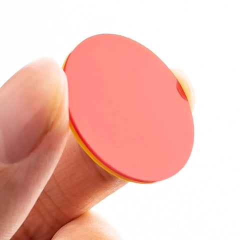 Round Math Counters Set, durable plastic counting chip in red and yellow held between fingers, vividly colored for easy visibility.