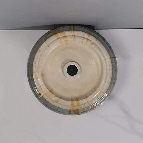 Top view of round ceramic bathroom vessel sink, featuring an art basin design, ideal for home or hotel counter use.