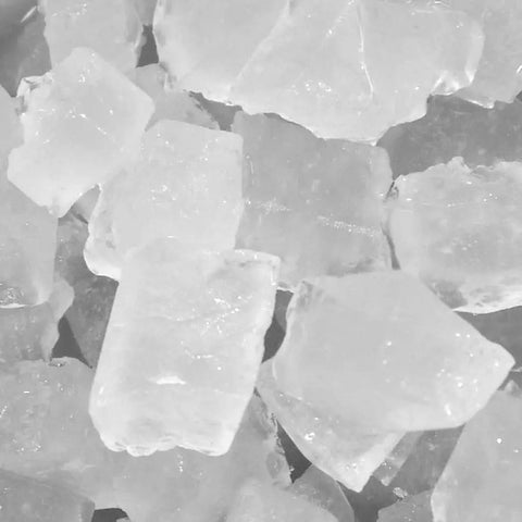 Close-up of smooth nugget ice produced by the Badass Commercial Cubelet Ice Machine, showcasing crystal-clear ice pieces.