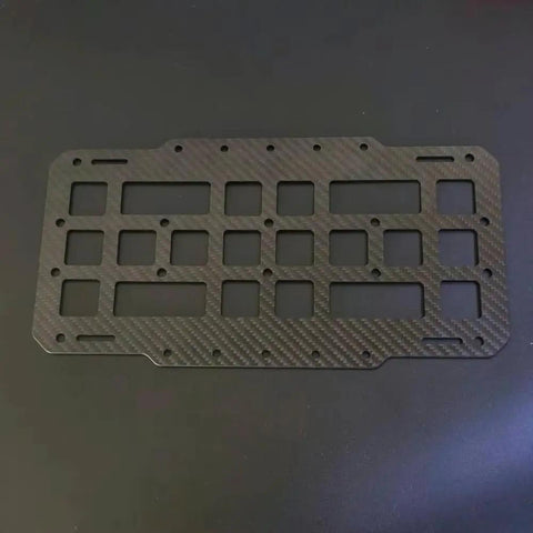 Rugged Tactical Sun Visor Rack With Reinforced Panels And Secure Lash Bands For Tesla Cybertruck, made of hard carbon fiber material.