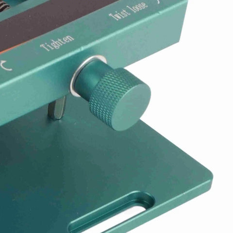 Close-up of a green adjustable clamp on a Rotatable LCD Screen Separator Heating Tool With Suction Cup And Adjustable Clamp For Mobile Phone Repair Diy Friendly Screen Replacement Easy To Apply On Various Phones And Safe For Rear Covers.