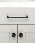 Matte Black Round Kitchen Cabinet Knobs and Drawer Knobs Set, 10 Pack, shown installed on modern white cabinetry