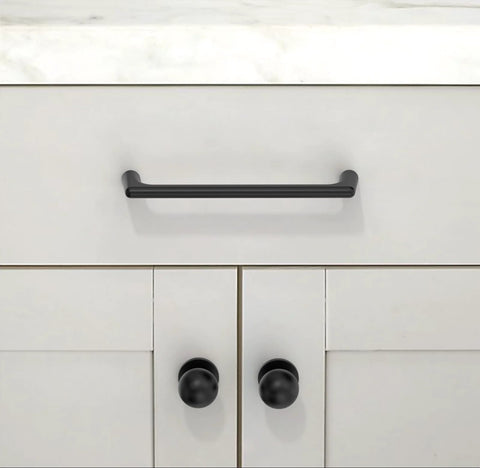 Matte Black Round Kitchen Cabinet Knobs and Drawer Knobs Set, 10 Pack, shown installed on modern white cabinetry