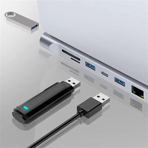 Slick 12 In 1 Type C Hub Docking Station With Crisp 4K Display, USB drives and ports on a silver laptop.