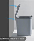 Gray trash can with lid open, showing use of 10 Pack Trash Can Protector Pads For Wall And Furniture Protection against wall.