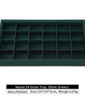 Top Tier PU Leather Jewelry Display Tray Featuring Twenty Four Secure Grid Slots For Rings Earrings And Brooches in dark green color.