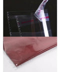 Close-up of 100 Pack Clear 9x12 Inch Self Adhesive Plastic Bags for Packaging Clothes and T Shirts with sealed edge detail.