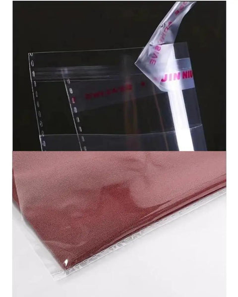 Close-up of 100 Pack Clear 9x12 Inch Self Adhesive Plastic Bags for Packaging Clothes and T Shirts with sealed edge detail.
