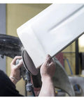 Person using Cool 20 Piece Assortment Of 5 Inch Mesh Hook Loop Sanding Discs With 80 To 600 Grit for sanding a white car part.