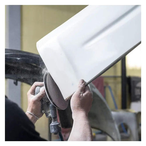 Person using Cool 20 Piece Assortment Of 5 Inch Mesh Hook Loop Sanding Discs With 80 To 600 Grit for sanding a white car part.