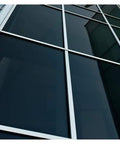 Building window with NA05 Window Film Daytime Privacy And Sun Control Natural Black 5 Very Dark 36 Inch By 12 Foot Roll For Home And Office