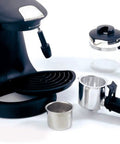 No Brainer Espresso And Cappuccino Maker With Instant Heat Capsule Compatibility featuring a black and silver design with components.