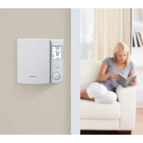 Five Two Day Programmable Thermostat For Electric Baseboard Heaters With Ultra Accurate Temperature Control mounted on wall