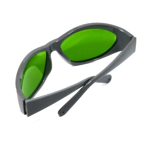 Heavy Duty Infrared Laser Safety Eyewear Providing Sweet Optical Density Ratings And Broad Waveband Coverage From Seven Forty To Eleven Hundred Nanometers with green lenses and gray frame.