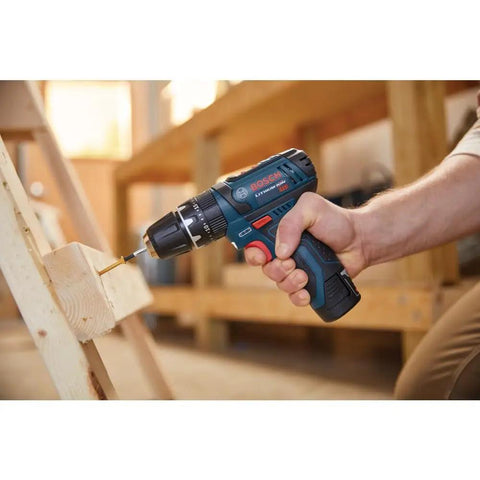 Ultra Compact 12V Max Hammer Drill And Driver Kit With 3/8 Inch Auto Chuck drilling wood, lightest in class at 2.3 lbs, ideal for DIY projects.