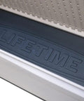 Interior base of 130 Gallon Desert Sand Deck Box With Weatherproof HDPE Construction showing "Lifetime" branding