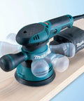 5 Inch Random Orbital Sander With 3.0 Amp Motor, Variable Speed From 4,000 To 12,000 OPM, Ergonomic Rubberized Palm Grip on wood