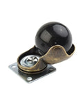 Four Pack Of 1.5 Inch Gold Ball Caster Wheels For Sofas And Ottomans Featuring Smooth 360 Degree Swivel Casters To Roll Furniture Around Home Without Breaking A Sweat Or Scratching Floors Ever - close-up of a gold swivel caster with a black ball.