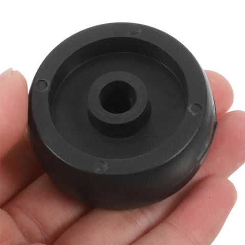 8 Pack 1.85 Inch Wear Resistant Replacement Wheels For Gym Equipment And Home Workout Machines Built To Last With Heavy Duty Roller Wheels Made From Tough PP And PA Material For Smooth Mobility Durable Fitness Spare Parts. Black PP and PA replacement wheel with center hole, held in hand.