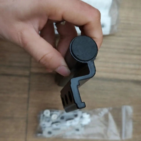 Person holding part of 2 Pack Thickened Broken Bridge Aluminum Door And Window Hinge Set, showing beefy aluminum hinge profile.