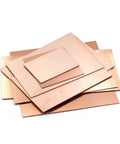 Stack of single sided copper clad PCB laminate sheets for DIY projects, 5 pcs of various sizes, showcasing durable laminate surface.
