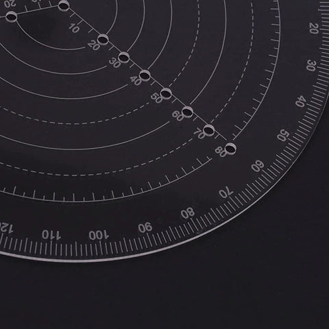 Close-up of LANRU round center finder compass, clear acrylic circle gauge with concentric scales and drilled holes