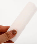 4-inch cotton roller sleeve held in hand, part of 15 Piece Mini Paint Roller Kit Featuring 4-Inch Cotton Rollers Perfect For Walls Edges And Furniture Updates.