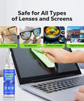 Kototo Eyeglass Cleaner Spray bottle with blue label, front view beside a laptop and microfiber cloth