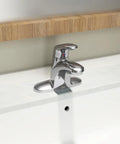 Colony Pro Single Handle Bathroom Sink Faucet With Metal Drain 1.2 GPM Polished Chrome installed on white sink