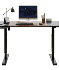 Solid Steel Frame Electric Standing Desk 55 Inches Adjustable Height Computer Table with black finish and monitor setup.