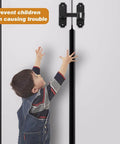 90/180 Degree Flip Barn Door Lock Security Latch For Sliding Doors And Cabinets Easy Install Privacy Gate Lock For Barn Garden Bathroom Window And More Matte Black Finish installed on cabinet with child reaching to open.